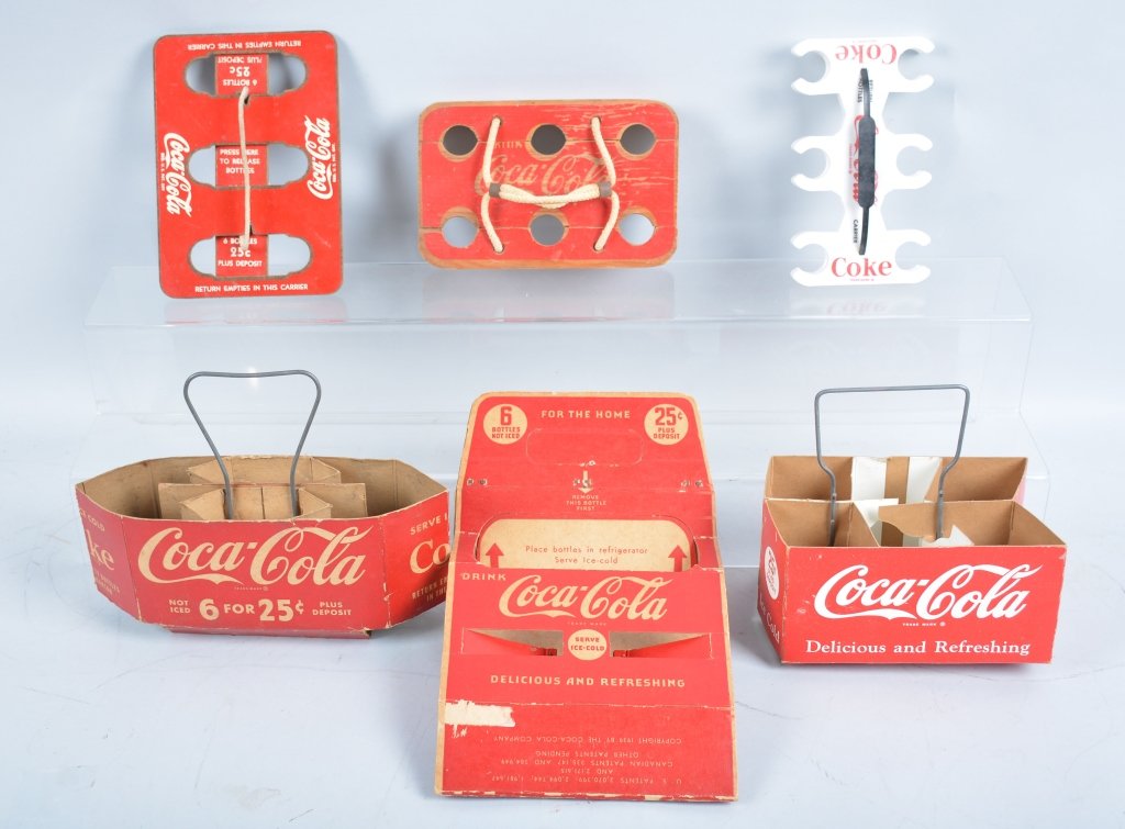 Lot of 11 Coca Cola Carriers: Includes many examples including wood, cardboard, holiday, and others. Excellent