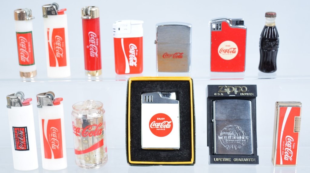 Lot of 12 Vintage Coca Cola Lighters: Nice collection including Zippos, Blue-Bird, Coke Bottle Style, and More. Some with boxes. Excellent-Near Mint