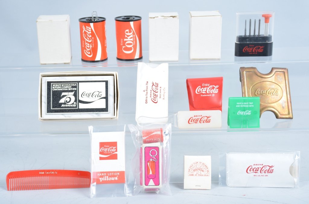 Lot of Misc Coca Cola Items: Includes Paper Clip Holders, Brush, Comb, Belt Buckle, Matches, Eye Glass Kit, Paper Weight, and More. All promotional gift items. Excellent