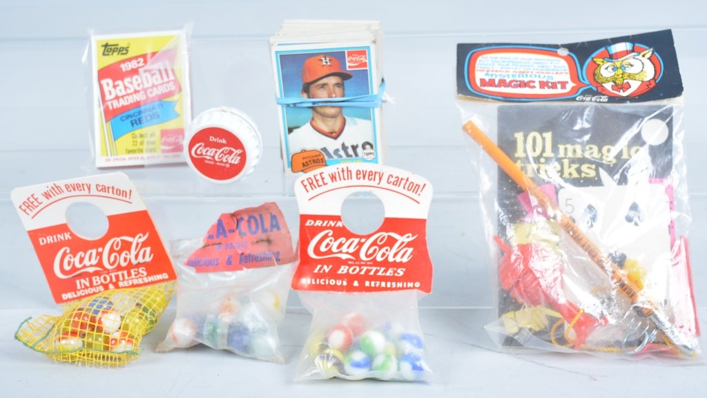 Lot of 5 Coca Cola Toys: Vintage toys include 3 sets of marbles, yoyo, and unusual Coca Cola magic set sealed on card. Excellent