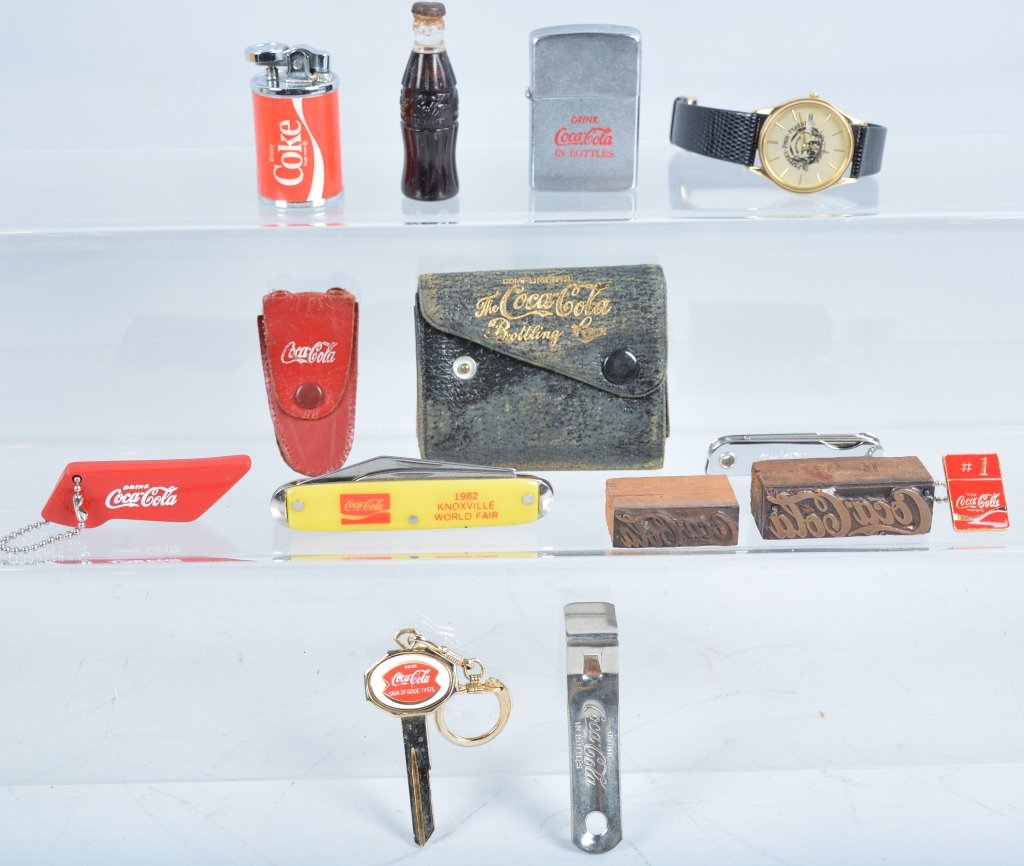 Vintage Coca Cola Lot: Very interesting lot includes, Ice picks, Lighters, Rubber Stamps, Wallet, Key Chain, Pocket Knife, and more. Excellent