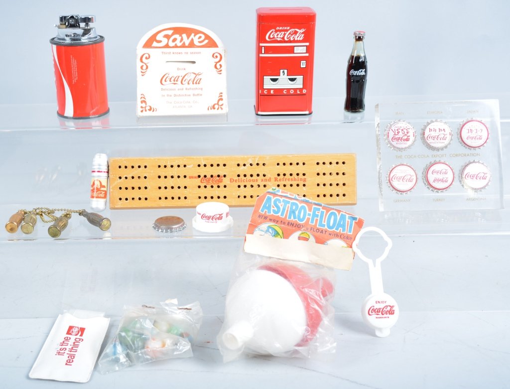 Coca Cola Lot: Nice mix of Coca Cola items. Includes lighters, Marbles, Astro Float, Key Chains, Paper Weight, and much more. Excellent