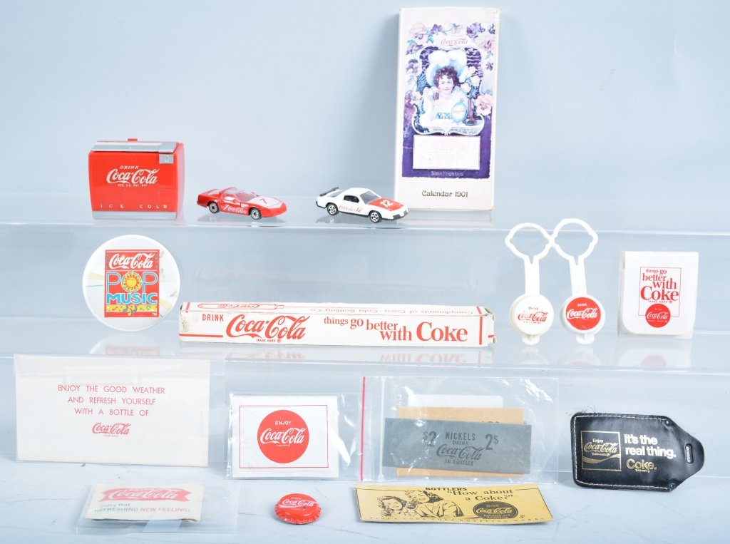 Coca Cola Lot: Intersting lot includes Mini Coca Cola Music Box, Ice Pick with Box, Buttons, Coin Wraps, Corgi Cars, and much more. Excellent