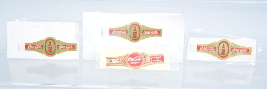 Lot of 4 1920s Coca Cola Cigar Bands: Includes Coca Cola Special and Coca Cola Bottle style. Beautiful colors and detail. Unusual items. Excellent