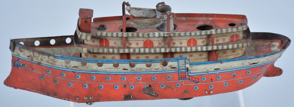 Orobr German Tin Windup Ship: All original very early German Ship. Looks to be missing 2 stakes. Does have original lifeboats. May clean to higher grade. Good