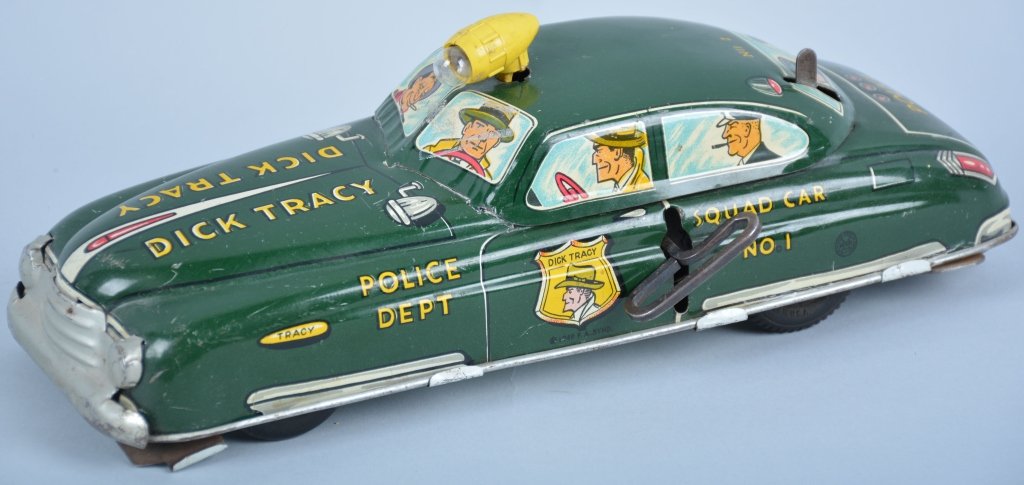 Marx Tin Windup DICK TRACY SQUAD CAR: All original with great color. Spotlight is loose. Very Good-Excellent. Battery box does show rust