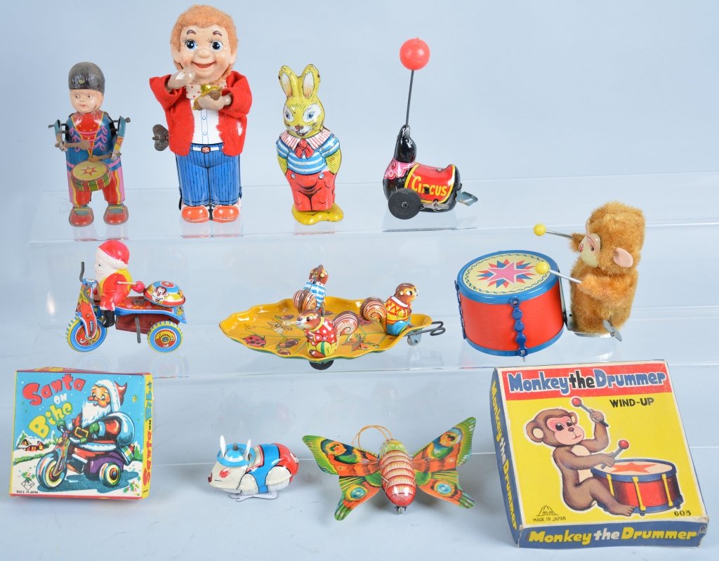 Lot of 8 WINDUP TOYS: Includes Monkey Drummer with Box, Santa on Trike with Box, Celluloid and Tin Drummer, TPS Seal pulling Animals, Butterfly, and 2 Rabbits. Very Good-Excellent
