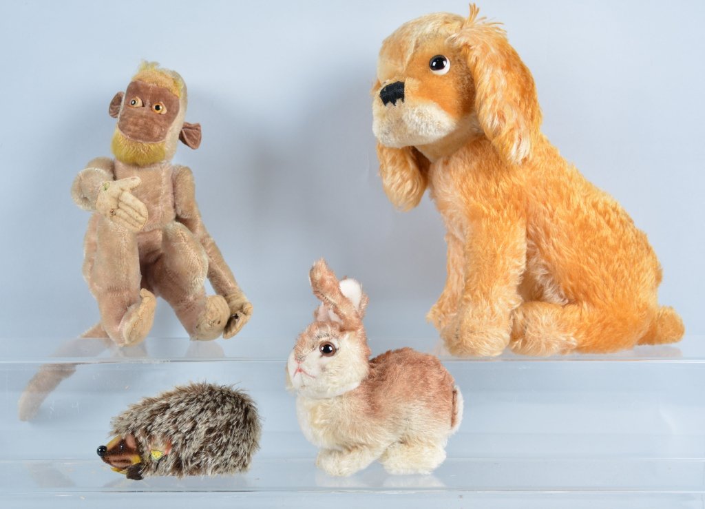 Lot of 4 STEIFF AMINALS: Nice early buttons. Includes 11" Sitting Dog, 5" Sitting Rabbit, 10" Monkey, and 5" Joggi. Some with buttons and tags. Very Good-Excellent
