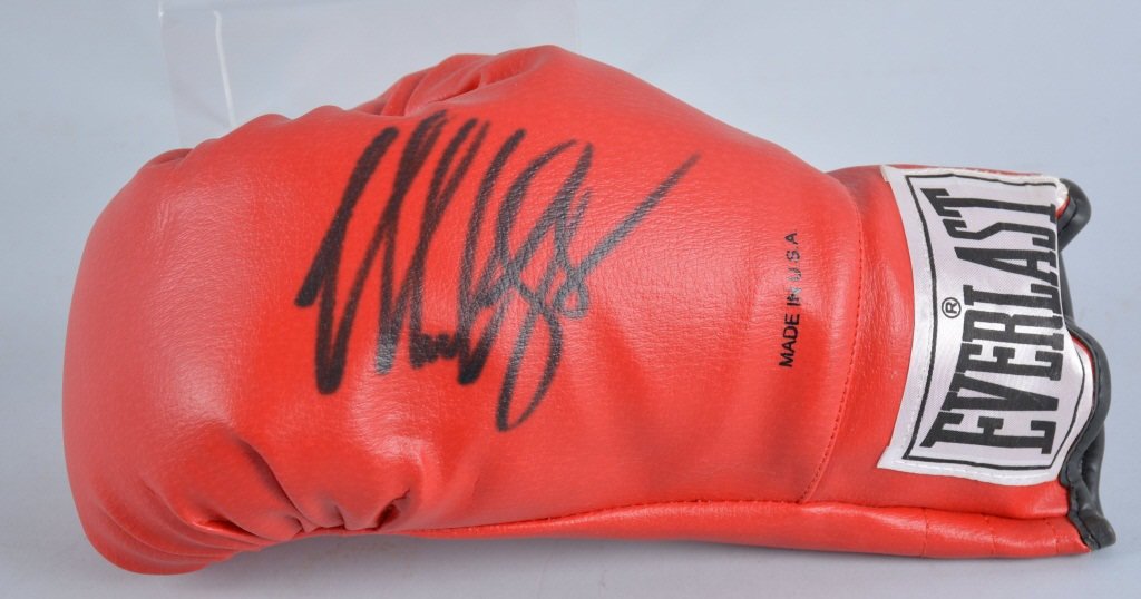 MIKE TYSON AUTOGRAPHED BOXING GLOVE: Everlast boxing glove autographed Mike Tyson. Excellent