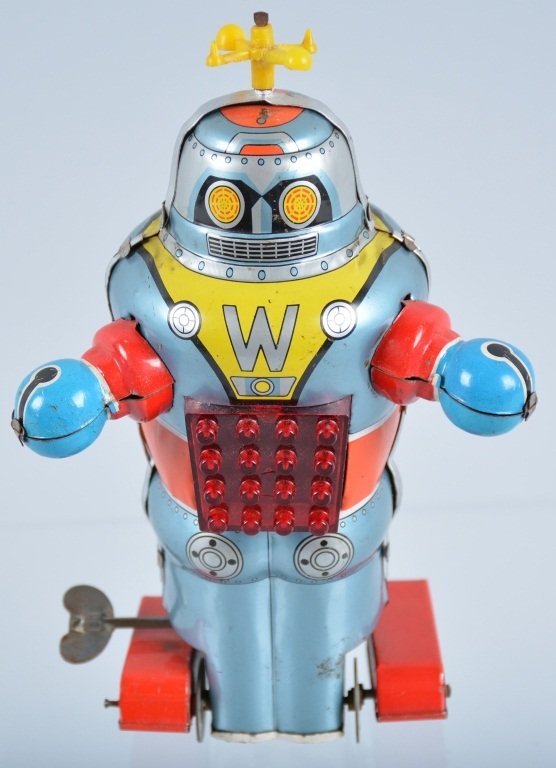 N JAPAN Tin Windup W ROBOT: Colorful tin windup robot with original antenna. Somne eadge wear throughout. 7" Tall. Very Good
