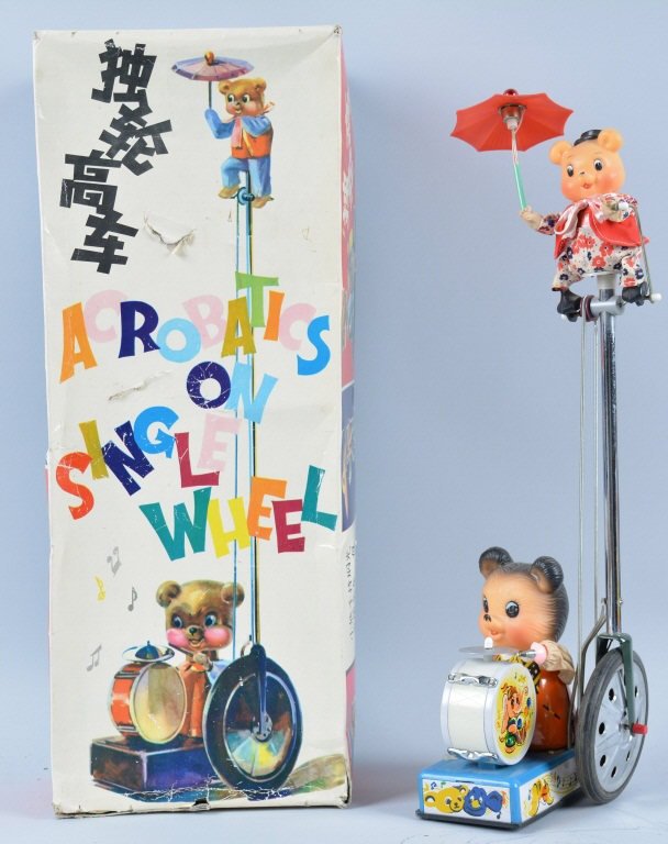 RED CHINA B.O. BEAR ACROBAT ON SINGLE WHEEL w/Box: Very unusual Battery Operated toy! Large and impressive 20" Tall! Toy has 2 very cute Bears one riding a tall unicycle the other playing the drums. Toy is unplayed with in original box with inserts. N