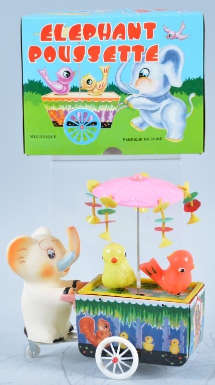 RED CHINA Tin Windup ELEPHANT PUSH Whirly Gig w/Bo: Very cute tin windup has Elephant puch cart with 2 Birds sitting on it. Cart has celluloid umbrella. Cart is tin very colorful animal graphics. Very whimsical toy! New Old Stock in Box. Near Mint
