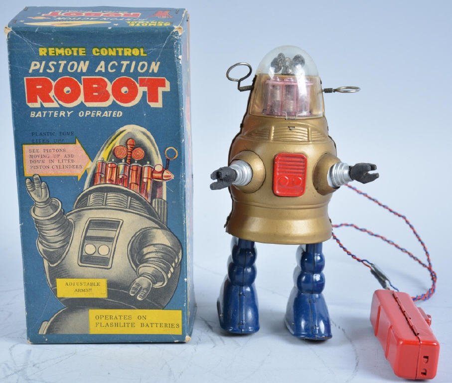 TN JAPAN Battery Op PISTON ACTION ROBOT w/Box: Excellent toy Robot is scrace Gold color. Known as the Pug Robby Robot. Great colors with original dome. Wires on remote have been spliced. With excellent box. Excellent