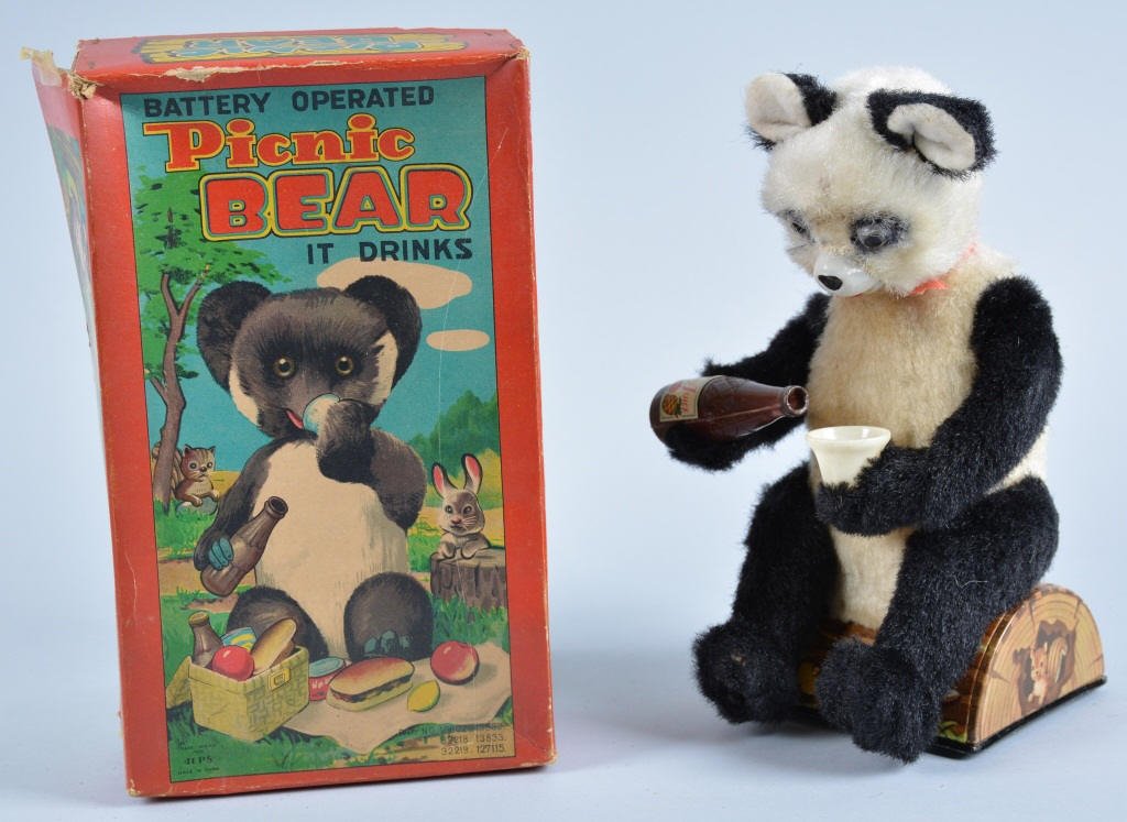 JAPAN Battery Op PICNIC BEAR w/Box: Very whimsical looking Panda Bear sitting on log drinking juice. Nice colors. With Box. Excellent