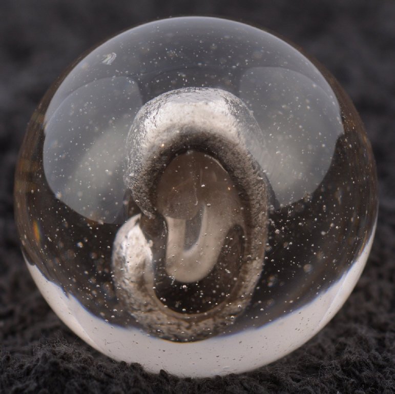# 6/9 SULFIDE MARBLE: Very nice marble. Has been polished. 1 15/32. Excellent