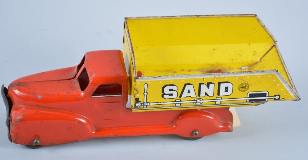 MARX Pressed Steel SAND and GRAVEL DUMP TRUCK: Nice early Marx truck with seperate grill. Litho Sand and Gravel Dump Bed. All original 10" long. Nice colors with minor scratching. Very Good