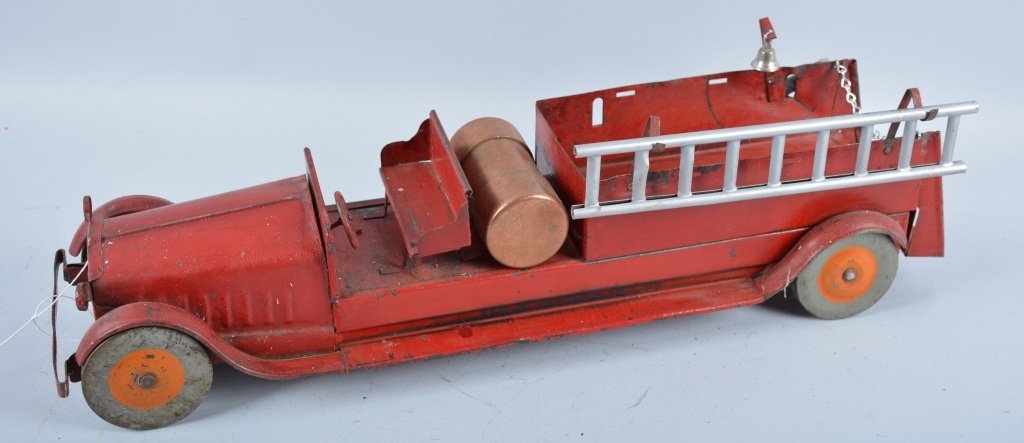 STEELCRAFT Pressed Steel FIRE TRUCK: Very early Steelcraft Fire Truck. Truck has original paint. A boiler, ladder, and bell have been added. Measures 24" long. Very nice looking primative truck. Very Good