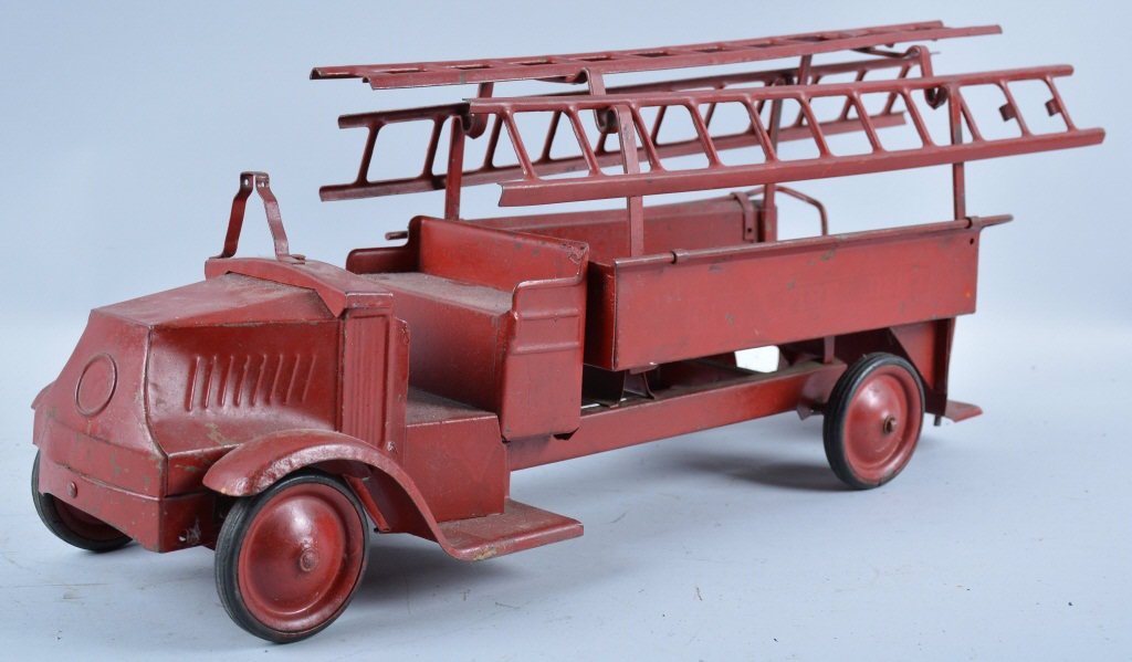 STEELCRAFT Pressed Steel BULLDOG MACK FIRE TRUCK: Great early Steelcraft Hook and Ladder Fire Truck. This is an original truck that has been repainted. Measures 24" long. Nice early toy with ladders and original rubber tires. Missing bell and steerin