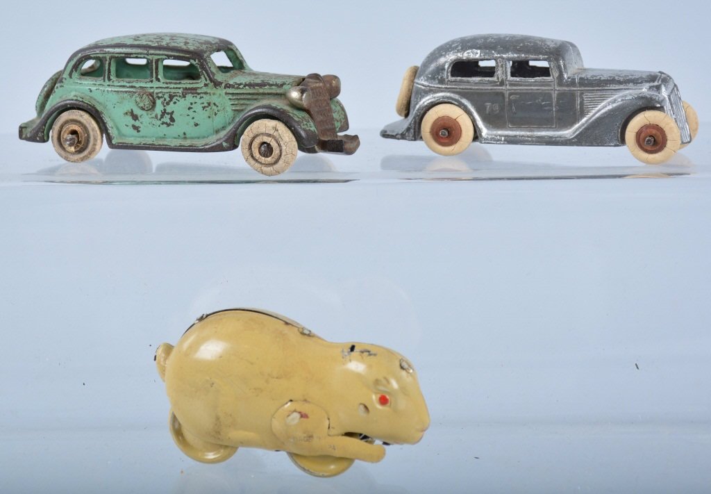 Lot of 2 Cast Iron and Slush Metal CARS & RABBIT: Includes Arcade Nickle Grill Sedan all original 4 1/2" long. Front bumper is broke. And Barclay Coupe. All original. 4" long. Lot also includes Tin Rabbit from Japan. Very Good