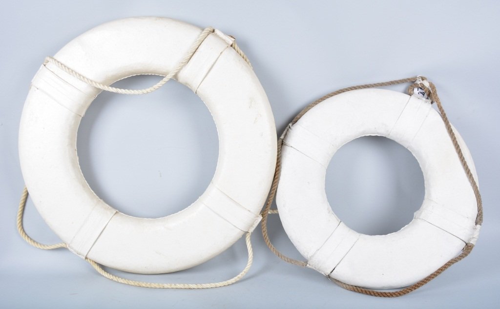 Lot of 2 Vintage Life Preservers: Nice pair of older life preservers, largest has a diameter of 30". Largest is Excellent, smaller one has a tear and is Very Good