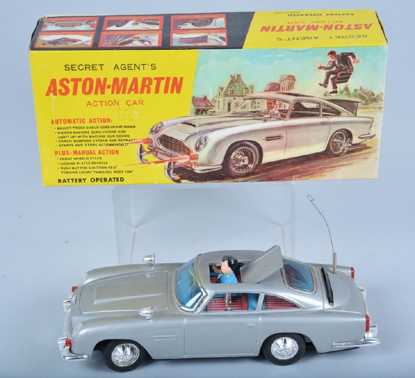 JAMES BOND 007 Battery Op ASTON MARTIN w/BOX: Excellent looking battery op James Bond 007 Aston Martin made by Gilbert in Japan. Toy is all original and in great shape. Works good. Come with colorful original box with great graphics. Excellent