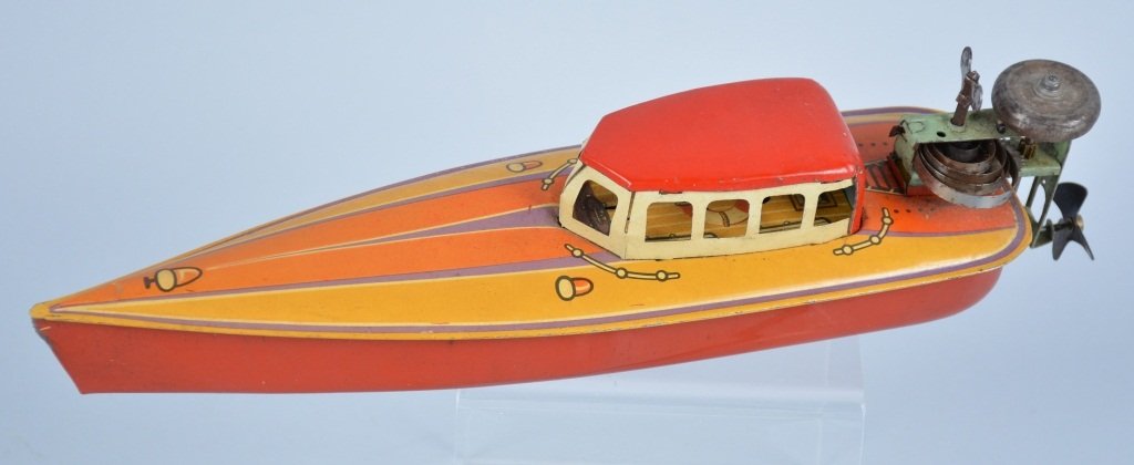US ZONE GERMANY Tin Windup BOAT with MOTOR: Nice looking tin windup Boat with Outboard Motor made in US Zone Germany. Great colors and details. Windup mech works well. Measures 11" long. Excellent