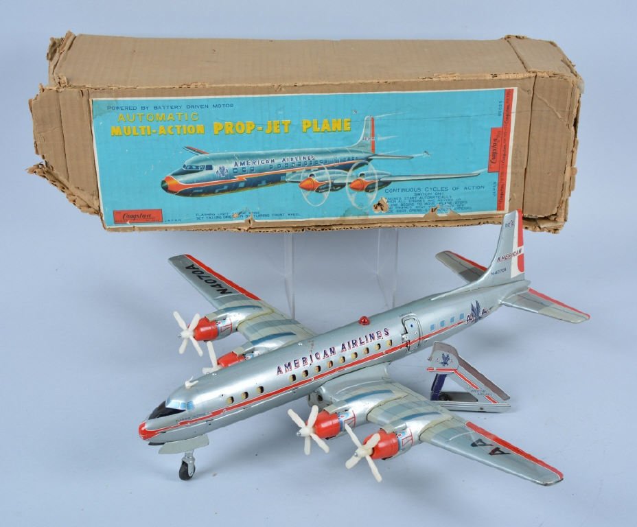 CRAGSTAN Battery Op MULTIAUCTION PROP JET PLANE: Excellent Cragstan Automatic Multi-Action Prop-Jet Plane. Great looking plane in American Airlines colors. Props work in sequence, door open and stewardess appears, and plane rolls along. Works well. 