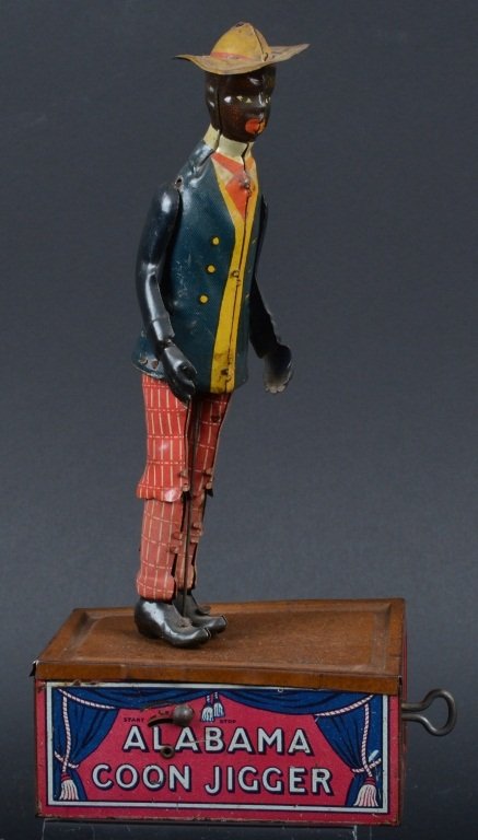 STRAUSS Tin Windup ALABAMA COON JIGGER: Great looking Strauss Alabama Coon Jigger Base with Lehmann figure. Nice original pieces. Figure has original arms and hat. Windup mech works. Nice colors on this toy. Very Good