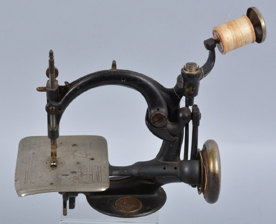 Wilcox & Gibbs, 19th Century Sewing Machine: Nice looking cast iron sewing machine measuring 11" long. Has slight bend to table, Very Good