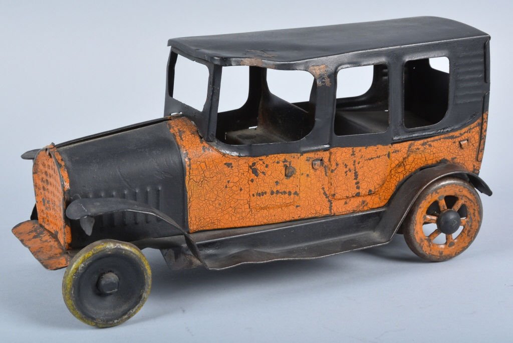 Pressed Steel HILL CLIMBER TAXI: Early pressed Steel Hill Climber Taxi Cab. Possibly Dayton. Original toy that has some touchup to black areas. Front wheels are replacements. Friction mech still works. Measures 11" long. Good