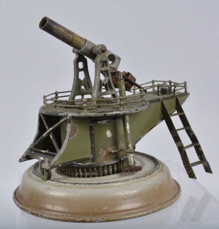 MARKLIN COASTAL DEFENSE GUN #2: Very nice all original Marklin Coastal Defense Gun. Toy is all original condition. The paint is very nice. Missing turn wheel and piece breech. Stairs missing railings. Base measures 6". Very Good