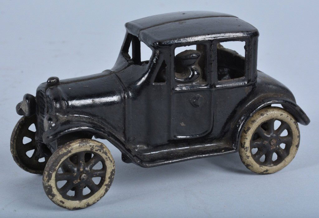 KENTON Cast Iron COUPE: Excellent all original Kenton cast Iron Coupe. Version with cast in driver and slanted window posts. All original paint. Very little wear. Great looking cast iron toy! 6" long. Excellent