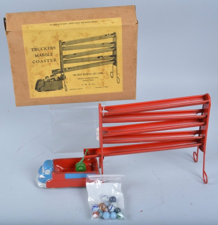TRUCKERS MARBLE COASTER w/Box: Very unusual toy made by CWM of Cleveland, Ohio. Truckers Marble Coaster. Includes a tin coaster set up that marbles roll back and forth along then work there way down and end up in original rubber to