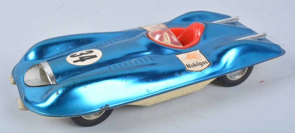 MATTEL Tin Friction DREAM RACE CAR: Nice looking tin Race Car. Toy is all original with nice paint and Mobilgas decals. Friction not working. Racer measures 12" long. Very Good