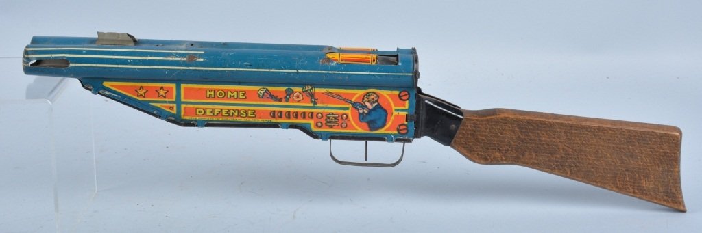 MARX Tin Windup HOME DEFENSE GUN: Nice early Marx toy. Tin and wood gun looks like Double Barrle Shotgun. Windup works. 22" long. Very Good
