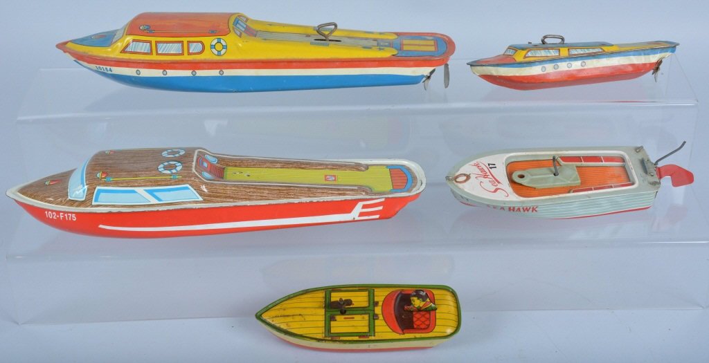 Lot of 5 Tin BOATS: Lot of 3 Chein Boats, Linstrom Boat, and Japan Boat. All nice originals. Some with windups. Largest measures 14". Very Good-Excellent