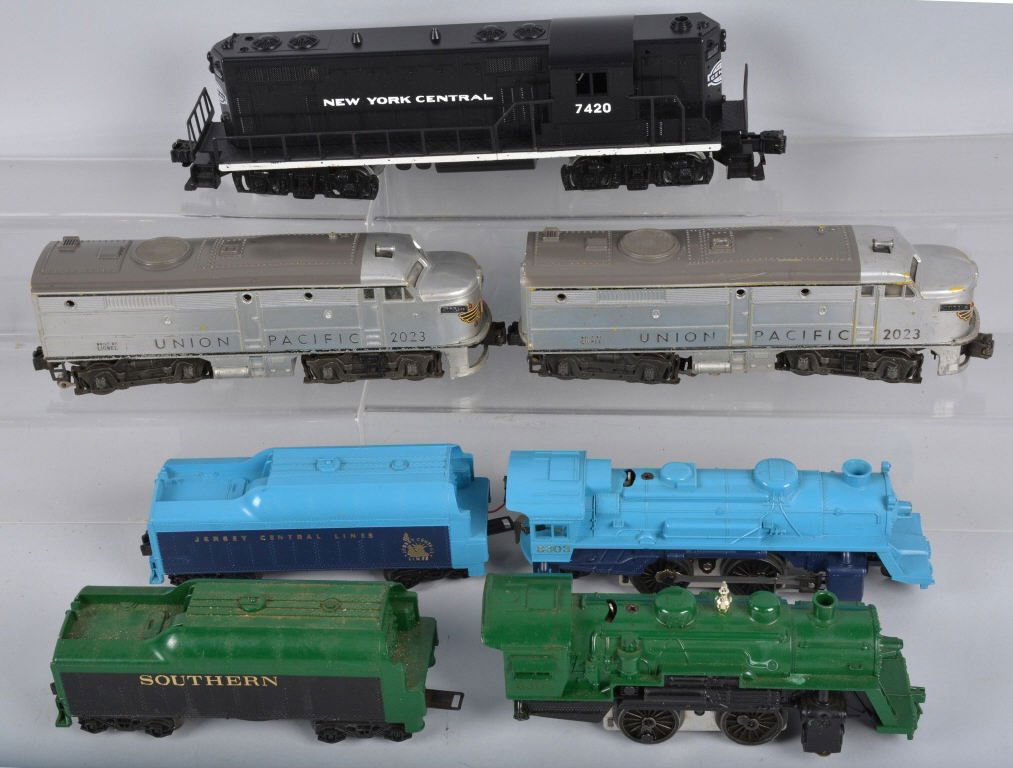 Lot of 4 LIONEL TRAIN ENGINES: Includes #2023 Union Pacific AB Unit, #7420 NYC, #8303 Jersey Central Engine and Tender, and #8302 Southern Engine and Tender. All original. Very Good-Excellent