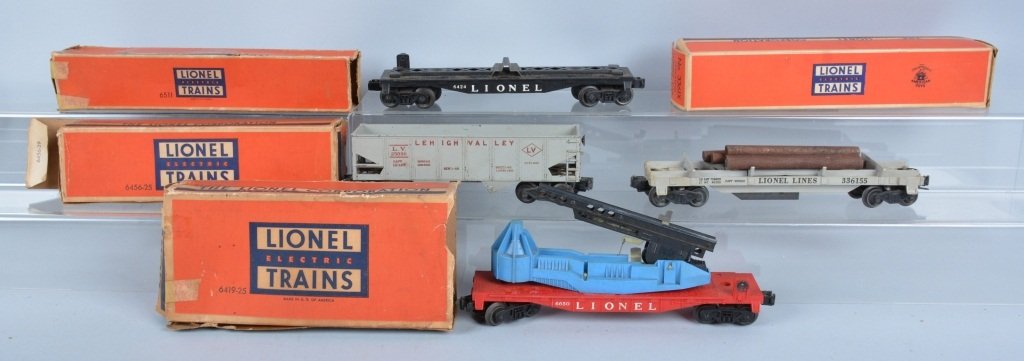 Lot of 4 LIONEL TRAIN CARS w/ BOX: Includes Lionel #3361x Operating lumber Car, #6419 Wrecking Car, #6456 Hopper Car, and #6511 Pipe Car. All boxed. Excellent