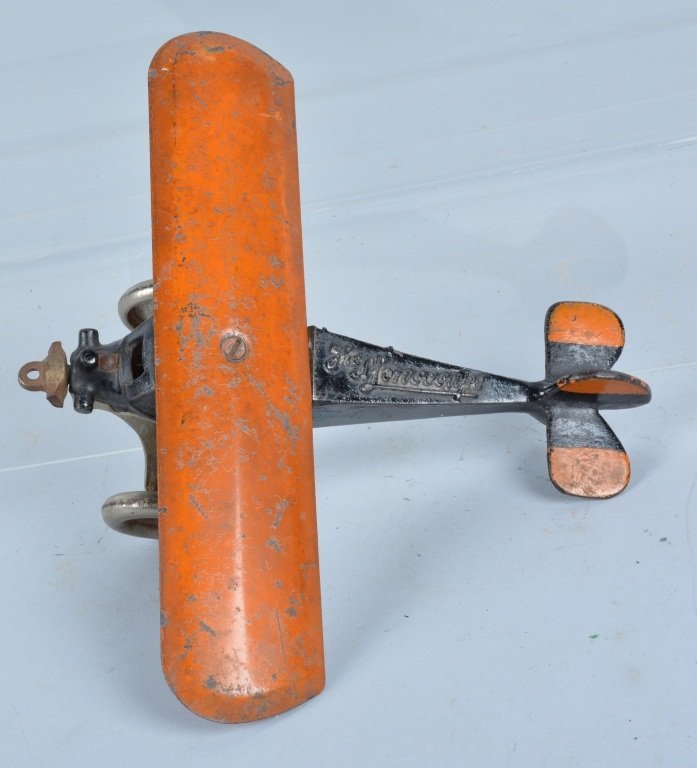 ARCADE Cast Iron MONOCOUPE AIRPLANE: All original cast iron Airplane made in Arcade. Has all original paint and great Arcade sticker on side. Nickel prop is broke. Very Good
