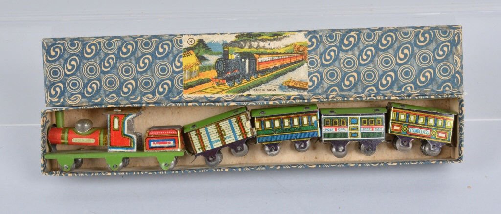 Prewar Japan PENNY TOY TRAIN SET w/ BOX: Very early Prewar Japan Penny Toy Train Set. Locomotive and Tender with 4 Cars. Great colors and details. With original box. 9" overall. Excellent