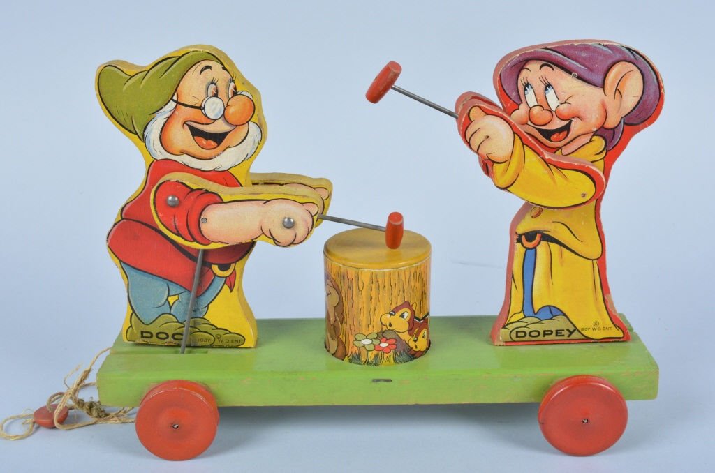 1937 FISHER PRICE #770 DOPEY & DOC DRUMMER: Beautiful all original Fisher Price from 1937. Excellent paper and colors. Still has original pull string. Excellent