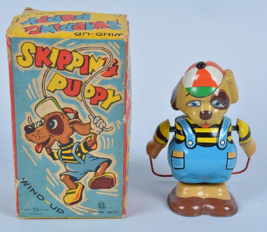 JAPAN Tin Windup SKIPPING PUPPY w/ BOX: Very colorful all original tin windup made in Japan. Great colors and details. Works well.With colorful original box. Excellent