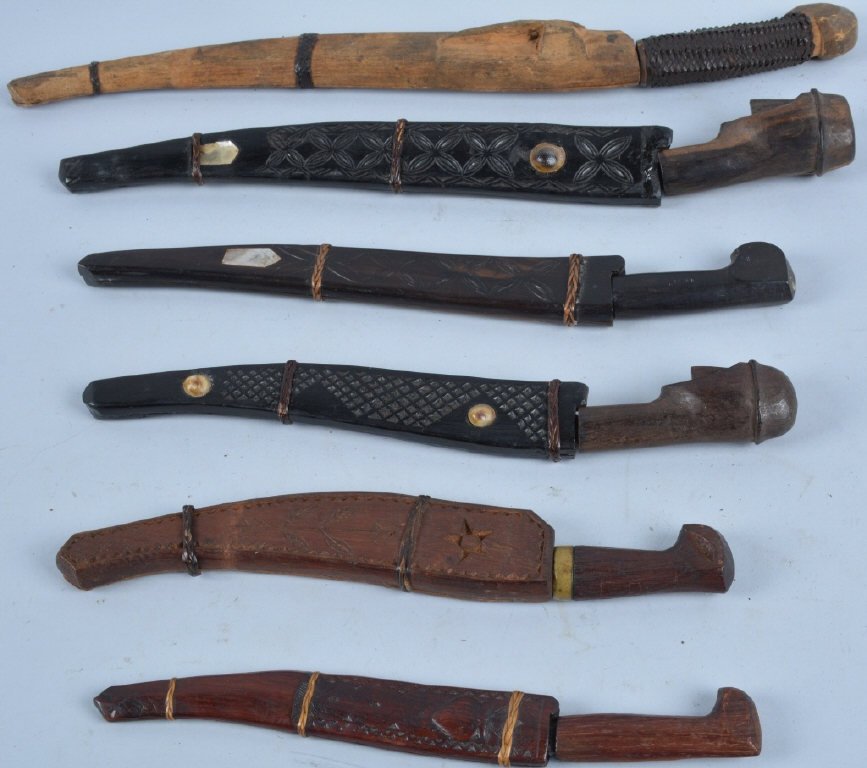 Lot of 6 WW2 Phillipino Knives: Nice grouping of native knives and scabbards. Largest is 14 1/2" long. Two have carved faces for pommels. Very Good