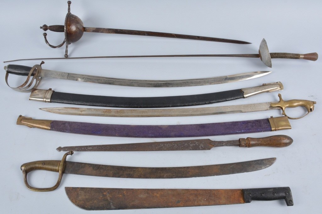 Lot of 7 Edged Weapons, Vintage: Diverse lot with a fencing sword, 2 Indian swords, an antique brass hilt Spanish sword, and more. Condition varies. Good-Very Good