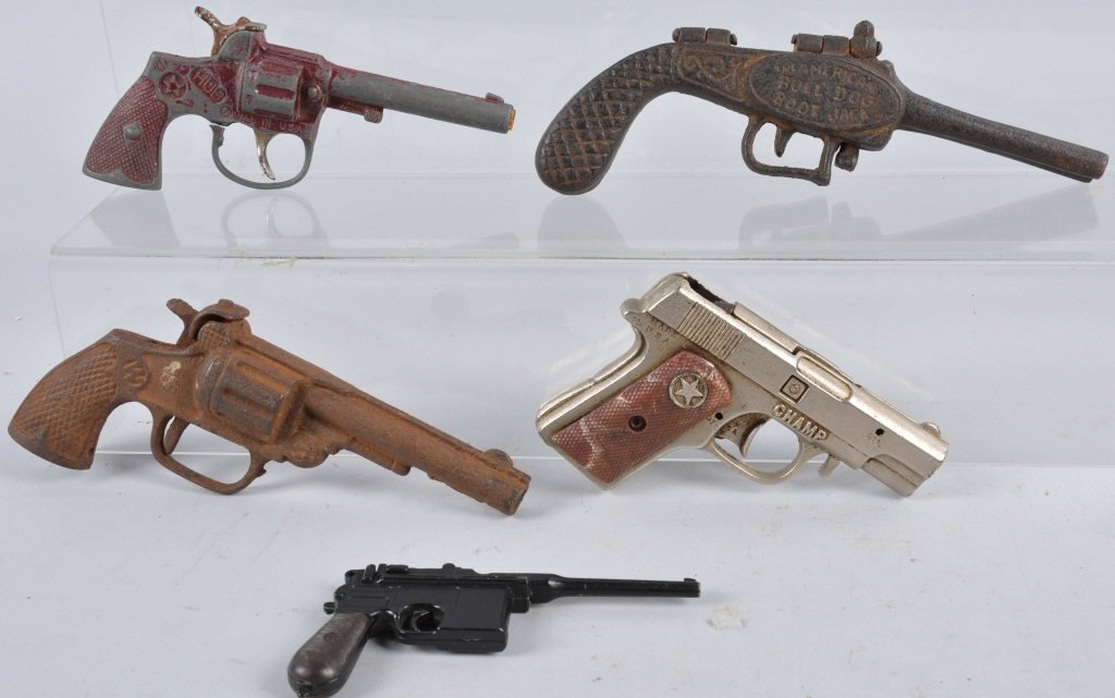 Lot of Vintage Toy Cap Guns and Boot Jack: Two of the cap guns and the Bull Dog boot jack are cast iron, The other cap guns are diecast. Condition varies, some not working. Good