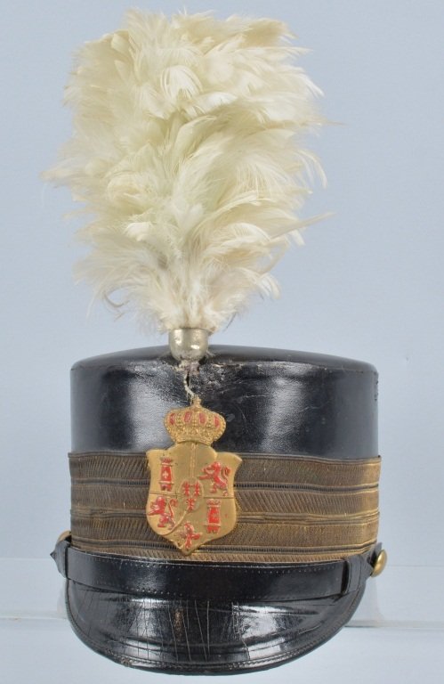 Antique Spanish Leather Military Shako: Nice original shako with a painted coat of arms badge on the front and original plume. Very Good