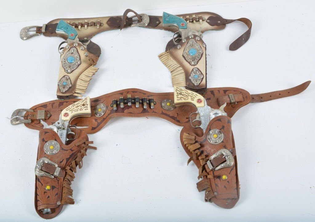 Lot of 2 Vintage CAP GUN HOLSTER SETS: Includes 2 Turquoise Texan Jr Cap Guns in matching Leather and Turquoise Holster and 2 Nichols Mustang Cap Guns in Leather Holster. All original with some play wear. Very Good
