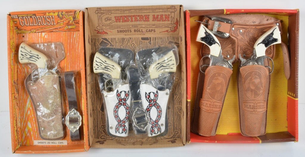 Lot of 3 CAP GUN HOLSTER SETS w/ BOX: Includes The Goldrush cap Gun Set sealed in Box, The Western Man Cap Gun Set sealed in Box, and Halco Marshall 2 Gun Holster Set in Box. Excellent