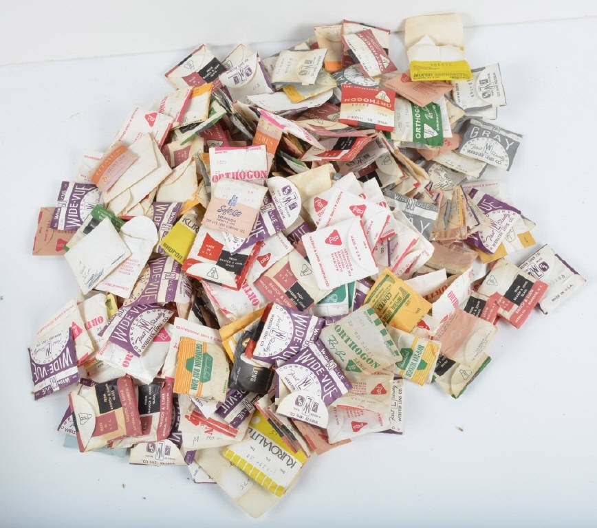 100s of VINTAGE NEW OLD STOCK EYE GLASS LENS: Very interesting lot of New Old Stock Eye Glass Lens still in packages. 100s in the collection. Excellent