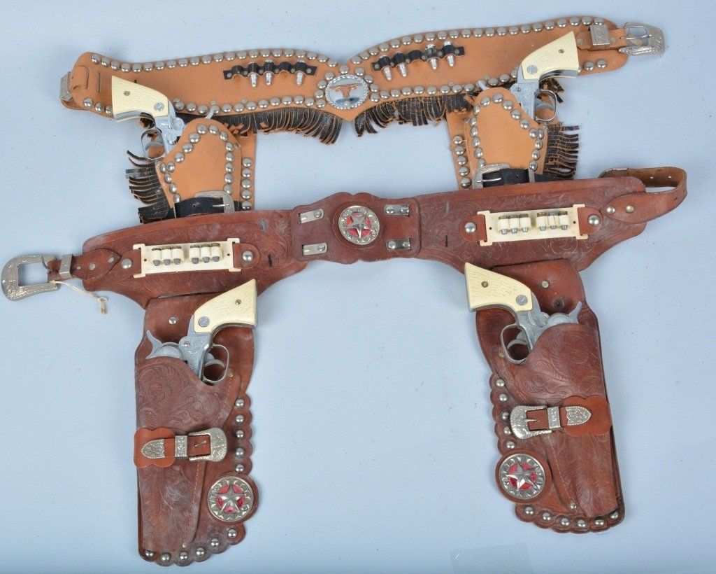 Lot of 2 NICHOLS STALLION 38 2-GUN HOLSTER SET: Nice lot of 2 Nichols Stallion 38 Cap Guns 2-gun holster sets. Nice looking guns with ornate leather holsters. Excellent